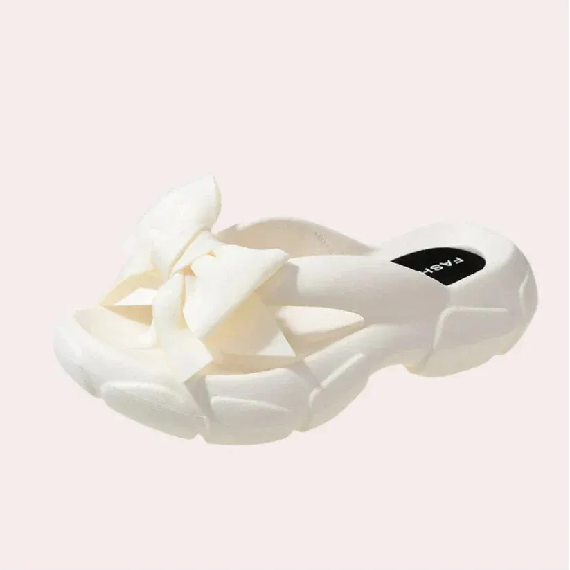 Elegant women's slippers, Damonie, featuring a bow detail